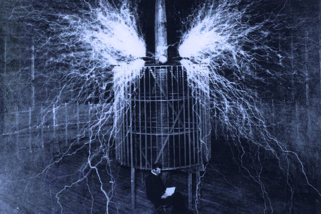 Tesla under a coil in the Colorado Springs laboratory